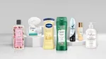 An assortment of Unilever brand products, including Dove soap, Love Beauty and Planet bodywash, and Suave shampoo.