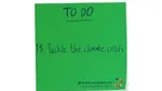 Green sticky note with Tackle the climate crisis written on it