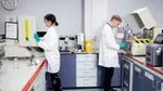 Two Unilever packaging material scientists testing samples to check their barrier properties against moisture, oxygen and light.