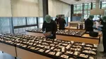 Meal4Meal programme: large tables with donated meals being packed