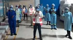 Unilever employees holding hand sanitizer in Africa